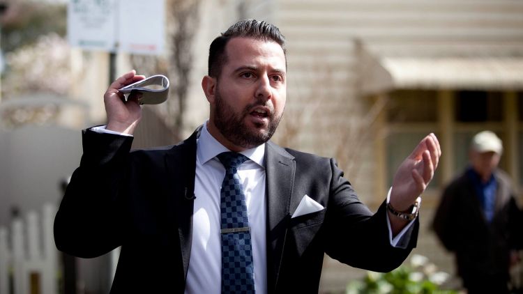 McGrath auctioneer Mike Divito in action at 41 Johnson St, Northcote, on Saturday. Photo: Arsineh Houspian